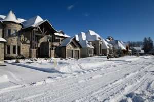 Row of subdivision houses in the winter with snow